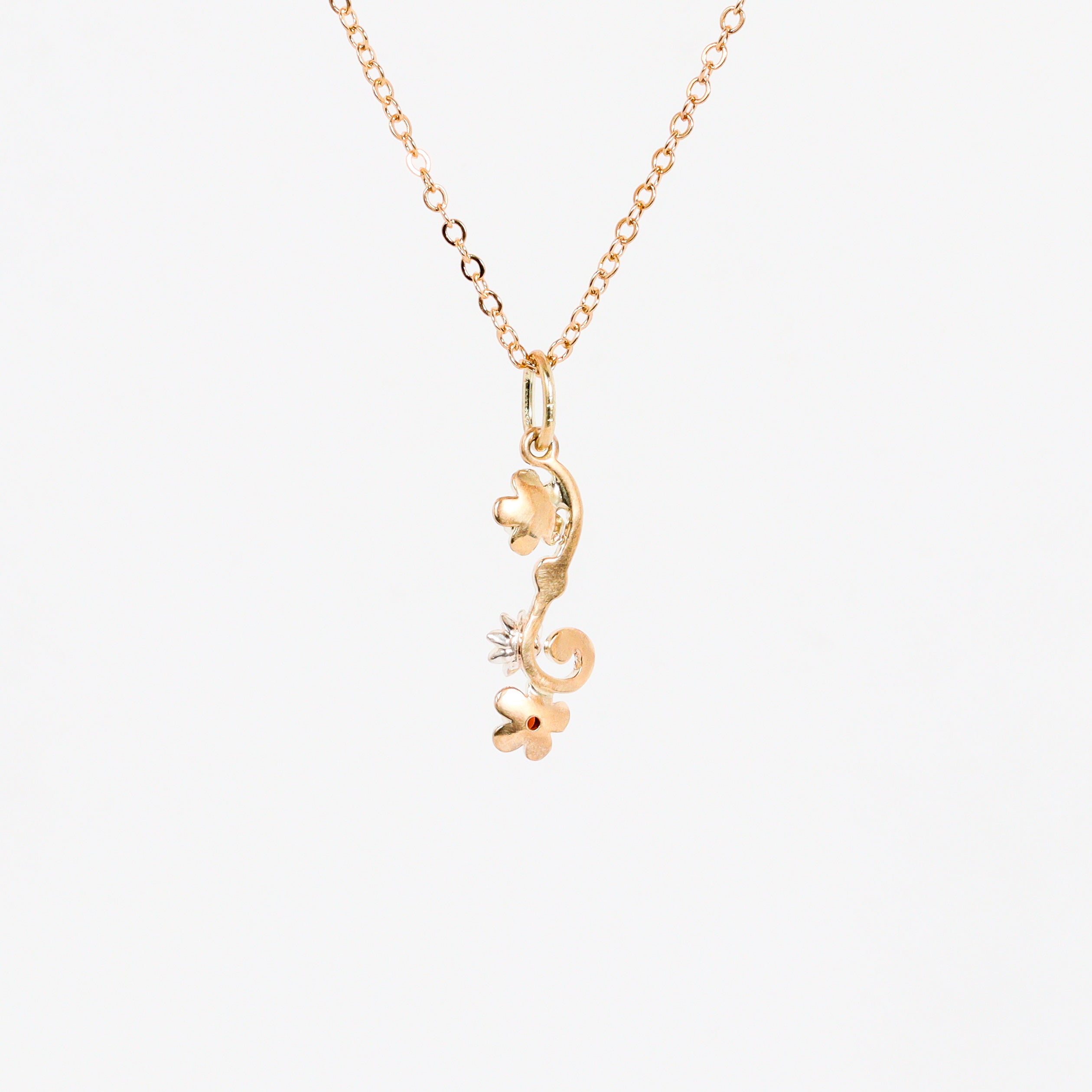 Leon Baker – 9KYG & Silver Wildflower Garnet & Pink Sapphire Pendant